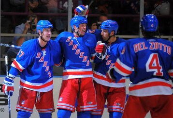 NEW YORK - OCTOBER 3: Brandon Dubinsky #17 of the New York Rangers is congratulated by Vinny Prospal #20, Michal Rozsival #33, and Michael Del Zotto #4, after scoring a second period goal against the Ottawa Senators at Madison Square Garden on October 3, 2009 in New York City. (Photo by Christopher Pasatieri/Getty Images)