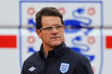 ST ALBANS, ENGLAND - OCTOBER 06: England manager Fabio Capello walks out to the England training session at London Colney on October 6, 2009 in St Albans, England.  (Photo by Michael Regan/Getty Images)