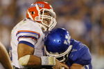 LEXINGTON, KY - SEPTEMBER 26: Quarterback Tim Tebow #15 of the Florida Gators is sacked by Taylor Wyndham #94 of the Kentucky Wildcats during the third quarter of the game at Commonwealth Stadium on September 26, 2009 in Lexington, Kentucky. (Photo by Andy Lyons/Getty Images)