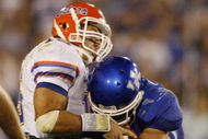 LEXINGTON, KY - SEPTEMBER 26: Quarterback Tim Tebow #15 of the Florida Gators is sacked by Taylor Wyndham #94 of the Kentucky Wildcats during the third quarter of the game at Commonwealth Stadium on September 26, 2009 in Lexington, Kentucky. (Photo by Andy Lyons/Getty Images)