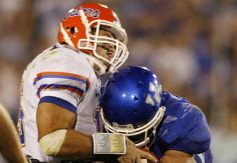 LEXINGTON, KY - SEPTEMBER 26: Quarterback Tim Tebow #15 of the Florida Gators is sacked by Taylor Wyndham #94 of the Kentucky Wildcats during the third quarter of the game at Commonwealth Stadium on September 26, 2009 in Lexington, Kentucky. (Photo by Andy Lyons/Getty Images)