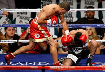 LAS VEGAS - DECEMBER 06:  (L-R) Juan Manuel Lopez of Puerto Rico connects a left to the head of Sergio Medina of Argentina during their WBO junior featherweight title fight at the MGM Grand Garden Arena December 6, 2008 in Las Vegas, Nevada.  (Photo by Ethan Miller/Getty Images)