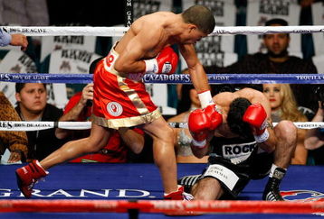 LAS VEGAS - DECEMBER 06:  (L-R) Juan Manuel Lopez of Puerto Rico connects a left to the head of Sergio Medina of Argentina during their WBO junior featherweight title fight at the MGM Grand Garden Arena December 6, 2008 in Las Vegas, Nevada.  (Photo by Ethan Miller/Getty Images)