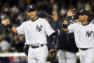 NEW YORK - OCTOBER 07: Derek Jeter #2 and Robinson Cano #24 of the New York Yankees celebrate after defeating the Minnesota Twins to win Game One of the ALDS during the 2009 MLB Playoffs at Yankee Stadium on October 7, 2009 in the Bronx borough of New York City. (Photo by Jim McIsaac/Getty Images)
