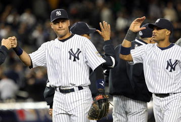 NEW YORK - OCTOBER 07:  Derek Jeter #2 and Robinson Cano #24 of the New York Yankees celebrate after defeating the Minnesota Twins to win Game One of the ALDS during the 2009 MLB Playoffs at Yankee Stadium on October 7, 2009 in the Bronx borough of New York City.  (Photo by Jim McIsaac/Getty Images)