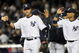NEW YORK - OCTOBER 07:  Derek Jeter #2 and Robinson Cano #24 of the New York Yankees celebrate after defeating the Minnesota Twins to win Game One of the ALDS during the 2009 MLB Playoffs at Yankee Stadium on October 7, 2009 in the Bronx borough of New York City.  (Photo by Jim McIsaac/Getty Images)