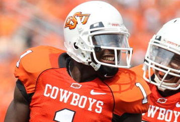 STILLWATER, OK - SEPTEMBER 5:  Wide receiver Dez Bryant #1 of the Oklahoma State Cowboys celebrates his touchdown with teammate Dexter Pratt #22 during the second quarter of the game against the Georgia Bulldogs at Boone Pickens Stadium on September 5, 2009 in Stillwater, Oklahoma. (Photo by Christian Petersen/Getty Images)