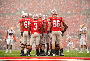 COLUMBUS, OH - SEPTEMBER 26:  The Ohio State Buckeyes offense huddles up before a play against the Illinois Fighting Illini at Ohio Stadium on September 26, 2009 in Columbus, Ohio.  (Photo by Jamie Sabau/Getty Images)