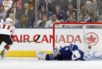 TORONTO - OCTOBER 6:  Daniel Alfredsson #11 of the Ottawa Senators scores on a penality shot as he puts the puck past Jonas Gustavsson #50 of the Toronto Maple Leafs during their NHL game at the Air Canada Centre October 6, 2009 in Toronto, Ontario, Canada.  (Photo By Dave Sandford/Getty Images)