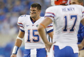 LEXINGTON, KY - SEPTEMBER 26: Quarterback Tim Tebow #15 of the Florida Gators walks on the sidelines near punter Chas Henry #17 during the second quarter of the game against the Kentucky Wildcats at Commonwealth Stadium on September 26, 2009 in Lexington, Kentucky. (Photo by Andy Lyons/Getty Images)