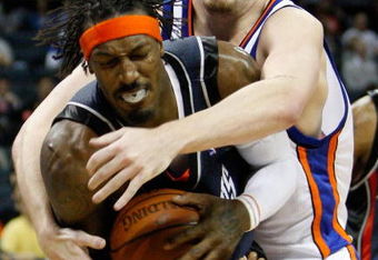 CHARLOTTE, NC - MARCH 28:  Gerald Wallace #3 of the Charlotte Bobcats is grabbed by David Lee #42 of the New York Knicks during their game at Time Warner Cable Arena on March 28, 2009 in Charlotte, North Carolina.  NOTE TO USER: User expressly acknowledges and agrees that, by downloading and/or using this Photograph, user is consenting to the terms and conditions of the Getty Images License Agreement.  (Photo by Streeter Lecka/Getty Images)