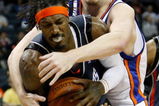 CHARLOTTE, NC - MARCH 28:  Gerald Wallace #3 of the Charlotte Bobcats is grabbed by David Lee #42 of the New York Knicks during their game at Time Warner Cable Arena on March 28, 2009 in Charlotte, North Carolina.  NOTE TO USER: User expressly acknowledges and agrees that, by downloading and/or using this Photograph, user is consenting to the terms and conditions of the Getty Images License Agreement.  (Photo by Streeter Lecka/Getty Images)