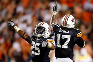 AUBURN, AL - SEPTEMBER 19: Daren Bates #25 and Josh Bynes #17 of the Auburn Tigers celebrate Bynes interception in the final minutes of their 41-30 win over the West Virginia Mountaineers at Jordan-Hare Stadium on September 19, 2009 in Auburn, Alabama. (Photo by Kevin C. Cox/Getty Images)