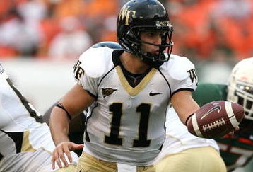 MIAMI - OCTOBER 25:  Quarterback Riley Skinner #11 of the Wake Forest Demon Decons looks to hand the ball off while taking on the Miami Hurricanes at Dolphin Stadium on October 25, 2008 in Miami, Florida. Miami defeated Wake Forest 16-10.  (Photo by Doug Benc/Getty Images)