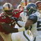 SAN FRANCISCO - NOVEMBER 7:  Offensive tackle Kwame Harris #77 of the San Francisco 49ers tries to hold a block against defensive end Chike Okeafor #50 of the Seattle Seahawks at Monster Park on November 7, 2004 in San Francisco, California. The Seahawks defeated the 49ers 42-27. (Photo by Jed Jacobsohn/Getty Images)