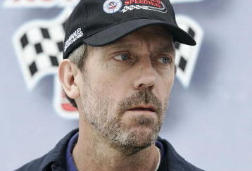 FONTANA, CA - FEBRUARY 22:  Actor Hugh Laurie waits to give the command to start engines prior to the NASCAR Sprint Cup Series Auto Club 500 at Auto Club Speedway on February 22, 2009 in Fontana, California.  (Photo by Geoff Burke/Getty Images for NASCAR)