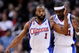 LOS ANGELES, CA - FEBRUARY 18:  Baron Davis #1 of the Los Angeles Clippers consoles Ricky Davis #31 during their , 142-119, loss to the Phoenix Suns at the Staples Center February 18, 2009, in Los Angeles, California. NOTE TO USER: User expressly acknowledges and agrees that, by downloading and or using this photograph, User is consenting to the terms and conditions of the Getty Images License Agreement.  (Photo by Kevork Djansezian/Getty Images)