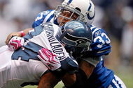 INDIANAPOLIS - OCTOBER 04:  T.J. Houshmandzadeh #84 of the Seattle Seahawks  is tackled by Melvin Bullitt #33 of the Indianapolis Colts during the NFL game against  at Lucas Oil Stadium on October 4, 2009 in Indianapolis, Indiana.  (Photo by Andy Lyons/Getty Images)