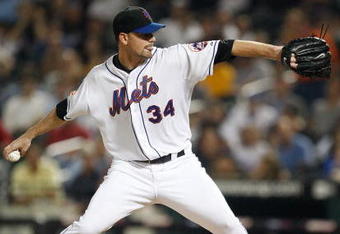 NEW YORK - SEPTEMBER 23:  Mike Pelfrey #34 of the New York Mets pitches against the Atlanta Braves during the game on September 23, 2009 at Citi Field in the Flushing neighborhood of the Queens borough of New York City.  (Photo by Jared Wickerham/Getty Images)
