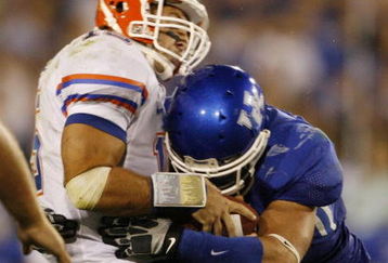 LEXINGTON, KY - SEPTEMBER 26: Quarterback Tim Tebow #15 of the Florida Gators is sacked by Taylor Wyndham #94 of the Kentucky Wildcats during the third quarter of the game at Commonwealth Stadium on September 26, 2009 in Lexington, Kentucky. (Photo by Andy Lyons/Getty Images)