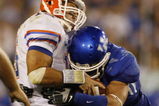 LEXINGTON, KY - SEPTEMBER 26: Quarterback Tim Tebow #15 of the Florida Gators is sacked by Taylor Wyndham #94 of the Kentucky Wildcats during the third quarter of the game at Commonwealth Stadium on September 26, 2009 in Lexington, Kentucky. (Photo by Andy Lyons/Getty Images)