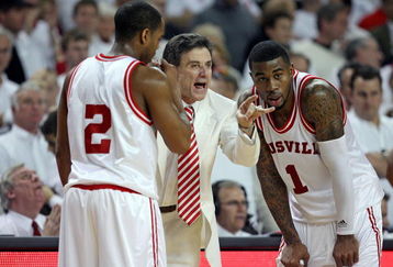 LOUISVILLE, KY - MARCH 01:  Rick Pitino the Head Coach of the Louisville Cardinals gives instructions to Preston Knowles #2 and Terrence Williams #1 during the Big East Conference game against the Marquette Golden Eagles at Freedom Hall on March 1, 2009 in Louisville, Kentucky.  (Photo by Andy Lyons/Getty Images)