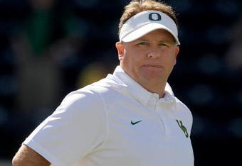 EUGENE, OR - SEPTEMBER 26: Head coach Chip Kelly of the Oregon Ducks watches his team go through warm ups before the game against the California Bears at Autzen Stadium on September 26, 2009 in Eugene, Oregon. Oregon won the game 42-3. (Photo by Steve Dykes/Getty Images)