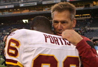 SEATTLE - NOVEMBER 23:  Head coach Jim Zorn of the Washington Redskins talks to running back Clinton Portis #26 after defeating the Seattle Seahawks 20-17 on November 23, 2008 at Qwest Field in Seattle, Washington. (Photo by Otto Greule Jr/Getty Images)