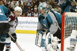 DENVER - MAY 1: Goalie Evgeni Nabokov #35 of the San Jose Sharks blocks a shot by Milan Hejduk of the Colorado Avalanche while Scott Hannan #22 keeps Joe Sakic #19 from getting to the rebound in the first period during game one of their Western Conference Semifinals at the Pepsi Center in Denver, Colorado.  (Photo by Brian Bahr/Getty Images