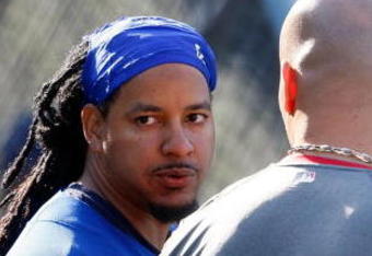 LOS ANGELES, CA - OCTOBER 07:  Manny Ramirez #99 of the Los Angeles Dodgers talks with Albert Pujols #5 of the St. Louis Cardinals before Game One of the NLDS during the 2009 MLB Playoffs at Dodger Stadium on October 7, 2009 in Los Angeles, California.  (Photo by Jeff Gross/Getty Images)