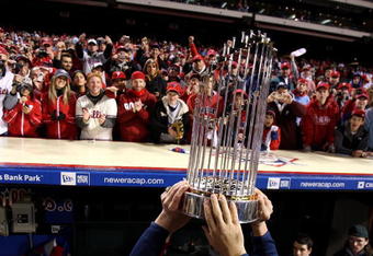 PHILADELPHIA - OCTOBER 29:  The World Series Championship trophy is held up in front of fans of the Philadelphia Phillies after they won 4-3 against the Tampa Bay Rays during the continuation of game five of the 2008 MLB World Series on October 29, 2008 at Citizens Bank Park in Philadelphia, Pennsylvania.  (Photo by Jed Jacobsohn/Getty Images)