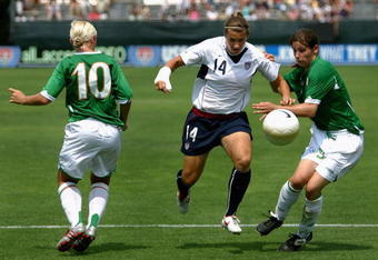 SAN DIEGO - JULY 23:  Amy LePeilbet #14 of Team USA drives with the ball past Katie Taylor #9 and Laura Hislop #10 of Team Ireland during the international women's soccer game held on July 23, 2006 at Torero Stadium in San Diego, California.   USa defeated Ireland 5-0.  (Photo by Christian Petersen/Getty Images)