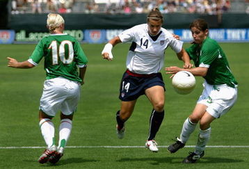 SAN DIEGO - JULY 23:  Amy LePeilbet #14 of Team USA drives with the ball past Katie Taylor #9 and Laura Hislop #10 of Team Ireland during the international women's soccer game held on July 23, 2006 at Torero Stadium in San Diego, California.   USa defeated Ireland 5-0.  (Photo by Christian Petersen/Getty Images)
