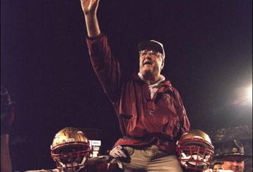 1 Jan 1996:  Head coach Bobby Bowden of the Florida State Seminoles is carried triumphantly off the field by nose guard Andre Wadsworth #8 and tackle Orpheus Roy after defeating the Notre Dame Fighting Irish in the Orange Bowl in Miami, Florida 31-26.  Ma