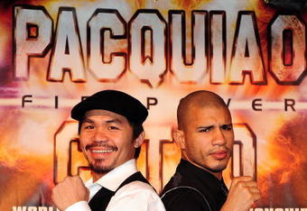 BEVERLY HILLS, CA - SEPTEMBER 14:  Manny Pacquiao and  Miguel Cotto pose for pictures during the press conference at the Beverly Hills Hotel on September 14, 2009 in Beverly Hills, California.  (Photo by Jacob de Golish/Getty Images)