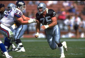 4 OCT 1992:  LOS ANGELES RAIDERS DEFENSIVE LINEMAN HOWIE LONG TRIES TO FIGHT THROUGH THE BLOCK OF NEW YORK GIANTS OFFENSIVE LINEMAN DOUG RIESENBERG DURING THE RAIDERS 13-10 VICTORY OVER THE GIANTS AT THE LOS ANGELES MEMORIAL COLISEUM IN LOS ANGELES, CALIF