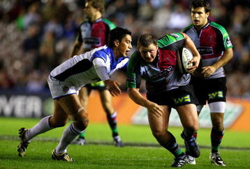RICHMOND UPON THAMES, ENGLAND - OCTOBER 03:  John Andress of Harlequins gets tackled by Shontayne Hape of Bath during the Guinness Premiership game between Harlequins and Bath at the Stoop on October 3, 2009 in Richmond upon Thames, England.  (Photo by Phil Cole/Getty Images)
