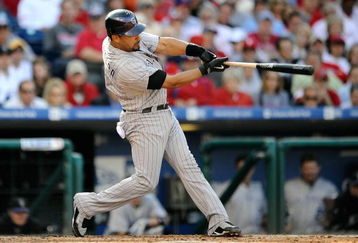 PHILADELPHIA - OCTOBER 08:  Yorvit Torrealba #8 of the Colorado Rockies hits a 2-run home run in the top of the fourth inninf against the Philadelphia Phillies in Game Two of the NLDS during the 2009 MLB Playoffs at Citizens Bank Park on October 8, 2009 in Philadelphia, Pennsylvania.  (Photo by Jeff Zelevansky/Getty Images)
