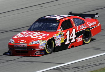 KANSAS CITY, KS - OCTOBER 02:  Tony Stewart, driver of the #14 Office Depot/Old Spice Chevrolet, drives during practice for the NASCAR Sprint Cup Series Price Chopper 400 presented by Kraft Foods at the Kansas Speedway on October 2, 2009 in Kansas City, Kansas.  (Photo by John Harrelson/Getty Images for NASCAR)