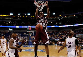 TAMPA, FL - MARCH 14:  Jarvis Varnado #32 of the Mississippi State Bulldogs dunks the ball around Quintin Thornton #32 of the Louisiana State University Tigers during the Semifinal round of the SEC Men's Basketball Tournament on March 14, 2009 at The St. Pete Times Forum in Tampa, Florida.  (Photo by Chris Graythen/Getty Images)