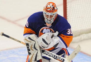 UNIONDALE, NY - OCTOBER 03: Goaltender Dwayne Roloson #30  makes a save against the Pittsburgh Penguins during the NHL hockey game at Nassau Coliseum on October 3, 2009 in Uniondale, New York. The Penguins defeated the Islanders 4-3 in shootout overtime.  (Photo by Paul Bereswill/Getty Images)