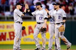 PHILADELPHIA - OCTOBER 08:  (L-R) Clint Barmes #12, Todd Helton #17, Ian Stewart #8 and Troy Tulowitzki #2 of the Colorado Rockies celebrate their 5-4 win against the Philadelphia Phillies in Game Two of the NLDS during the 2009 MLB Playoffs at Citizens Bank Park on October 8, 2009 in Philadelphia, Pennsylvania.  (Photo by Jeff Zelevansky/Getty Images)