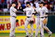 PHILADELPHIA - OCTOBER 08:  (L-R) Clint Barmes #12, Todd Helton #17, Ian Stewart #8 and Troy Tulowitzki #2 of the Colorado Rockies celebrate their 5-4 win against the Philadelphia Phillies in Game Two of the NLDS during the 2009 MLB Playoffs at Citizens Bank Park on October 8, 2009 in Philadelphia, Pennsylvania.  (Photo by Jeff Zelevansky/Getty Images)