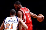 NEW YORK - JANUARY 26: Tracy McGrady #1 of the Houston Rockets looks for options under pressure from Wilson Chandler #21 of the New York Knicks at Madison Square Garden January 26, 2009 in New York City. NOTE TO USER: User expressly acknowledges and agrees that, by downloading and/or using this Photograph, User is consenting to the terms and conditions of the Getty Images License Agreement.  (Photo by Chris McGrath/Getty Images)