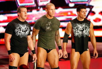 LAS VEGAS - AUGUST 24:  (L-R) Wrestlers Ted DiBiase, Randy Orton and Cody Rhodes appear during the WWE Monday Night Raw show at the Thomas & Mack Center August 24, 2009 in Las Vegas, Nevada.  (Photo by Ethan Miller/Getty Images)