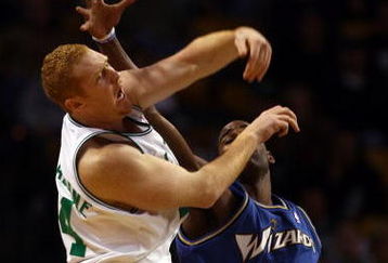 BOSTON - NOVEMBER 02:  Brian Scalabrine #44 of the Boston Celtics nabs the rebound and passes it as Antawn Jamison #4 of the Washington Wizards tries to get the ball on November 2, 2007 at the TD Banknorth Garden in Boston, Massachusetts. The Celtics defeated the Wizards 103-83. NOTE TO USER: User expressly acknowledges and agrees that, by downloading and or using this Photograph, user is consenting to the terms and conditions of the Getty Images License Agreement.  (Photo by Elsa/Getty Images)