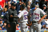 CHICAGO - AUGUST 30: Manager Jerry Manuel #53 of the New York Mets argues with first base umpire Bill Welke #52 as Daniel Murphy #28 waits during a game against the Chicago Cubs on August 30, 2009 at Wrigley Field in Chicago, Illinois. The Mets defeated the Cubs 4-1. (Photo by Jonathan Daniel/Getty Images)