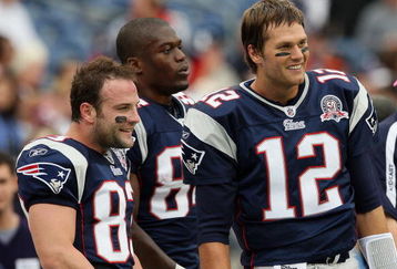 FOXBORO, MA - OCTOBER 4:  (L-R) Wes Welker #83, Benjamin Watson #84, and Tom Brady #12 of the New England Patriots, stand on the sideline before a game with the Baltimore Ravens at Gillette Stadium on October 4, 2009 in Foxboro, Massachusetts. (Photo by Jim Rogash/Getty Images)