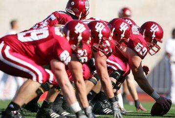 BLOOMINGTON, IN - NOVEMBER 3:  The Indiana Hoosiers offensive unit is pictured at the line of scrimmage against the Ball State Cardinals during the game at Memorial Stadium November 3, 2007 in Bloomington, Indiana.  (Photo by Andy Lyons/Getty Images)