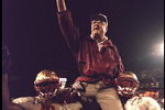 1 Jan 1996:  Head coach Bobby Bowden of the Florida State Seminoles is carried triumphantly off the field by nose guard Andre Wadsworth #8 and tackle Orpheus Roy after defeating the Notre Dame Fighting Irish in the Orange Bowl in Miami, Florida 31-26.  Ma